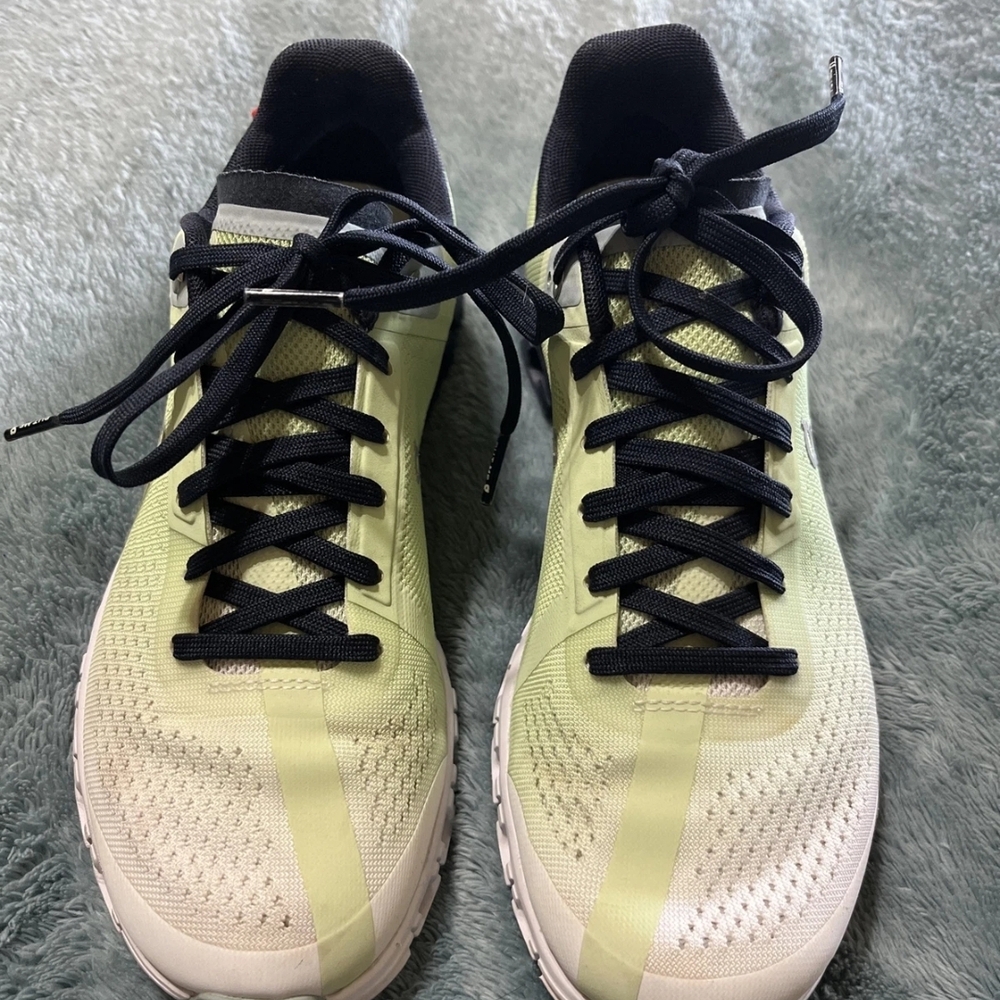 On Running Black and Cream Athletic Shoes Sleek Design
